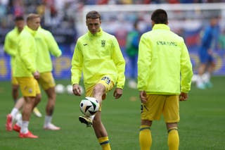 Ukrainian players, including Ukrainian forward Vladislav Vanat, warm up before the UEFA Euro 2024 Group E match between Slovakia and Ukraine at Dusseldorf Arena in Dusseldorf, Germany.