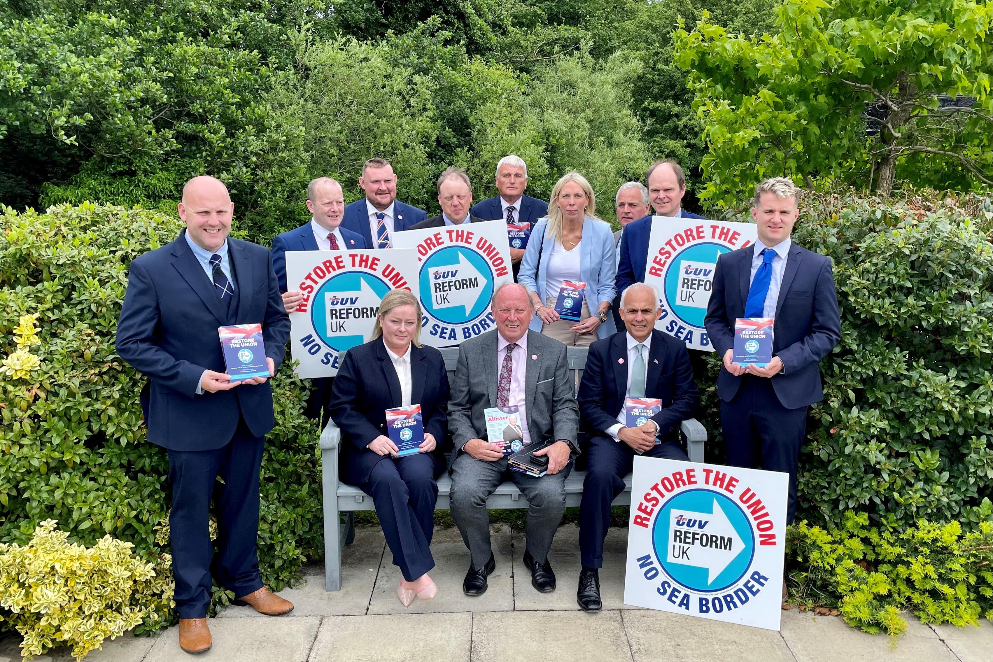 Reform UK deputy leader Ben Habib (on the bench, right) and TUV leader Jim Allister (on the bench centre) with parliamentary election candidates at the TUV manifesto launch (David Young/PA)