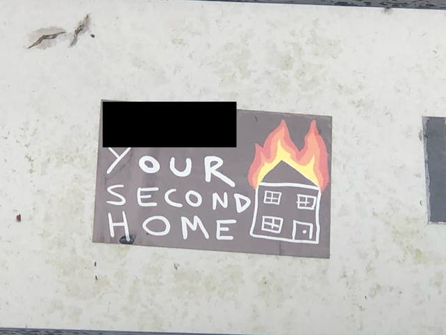 <p>Disturbing stickers appearing to threaten setting second homes on fire have appeared in the Lake District</p>