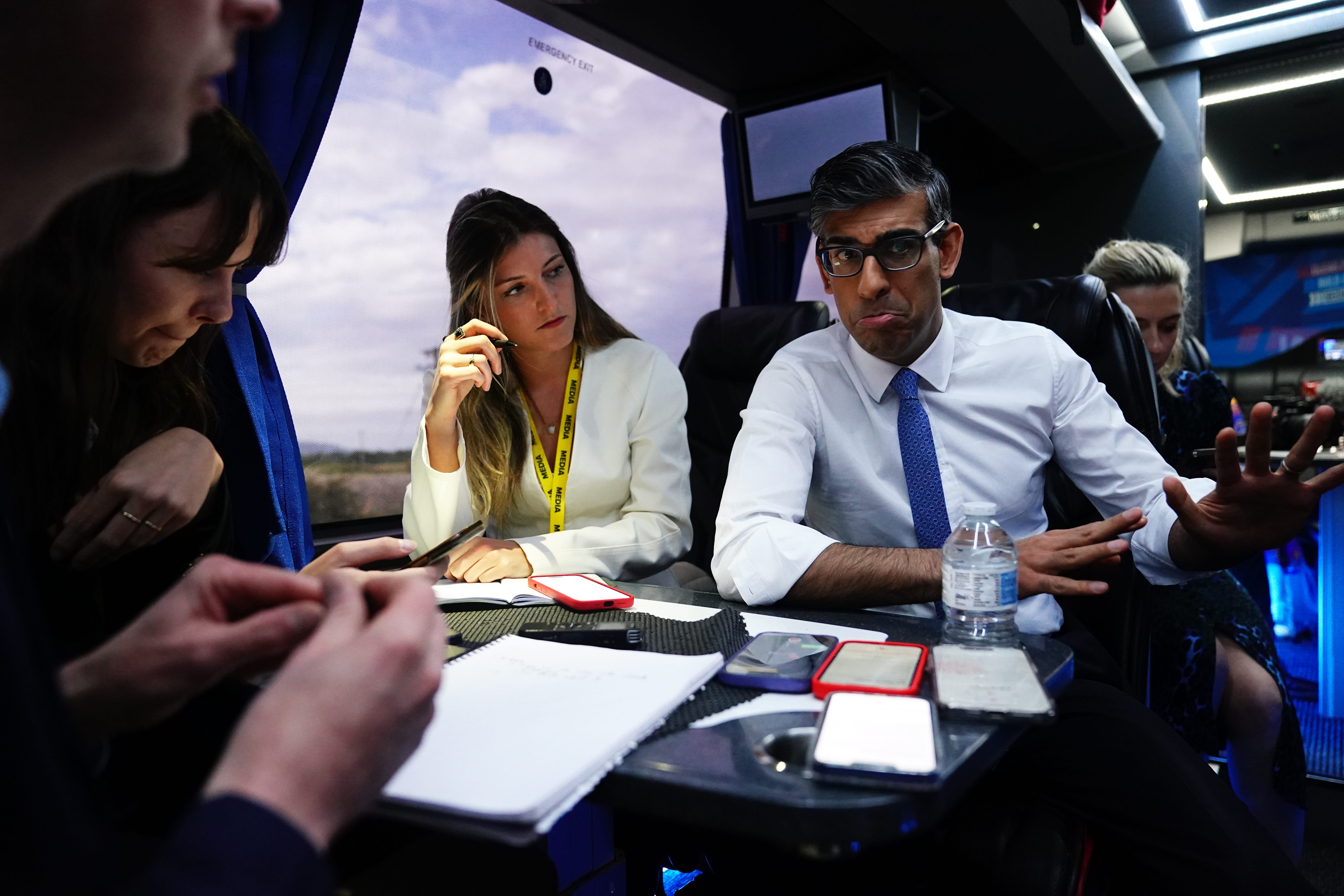 Prime Minister Rishi Sunak talks to journalists on board his campaign battle bus after visiting a bathroom supply company near Rhyl, Wales, while on the General Election campaign trail (Aaron Chown/PA)