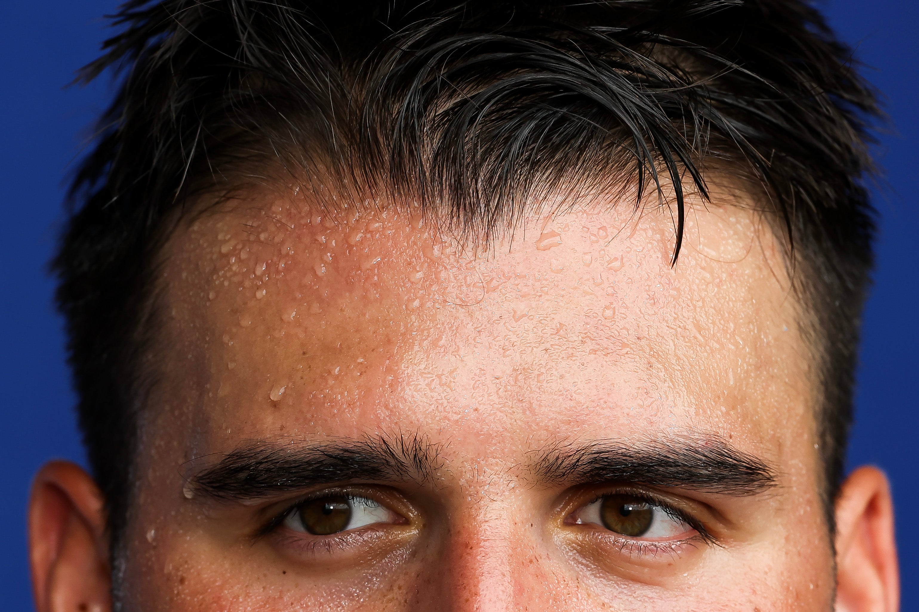 Sweat runs down the forehead of Jon Runyan #76 of the New York Giants, taken after an offseaon workout during New York’s heatwave