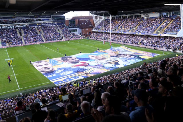 A large banner in tribute to Rob Burrow was displayed before the game (Danny Lawson/PA)