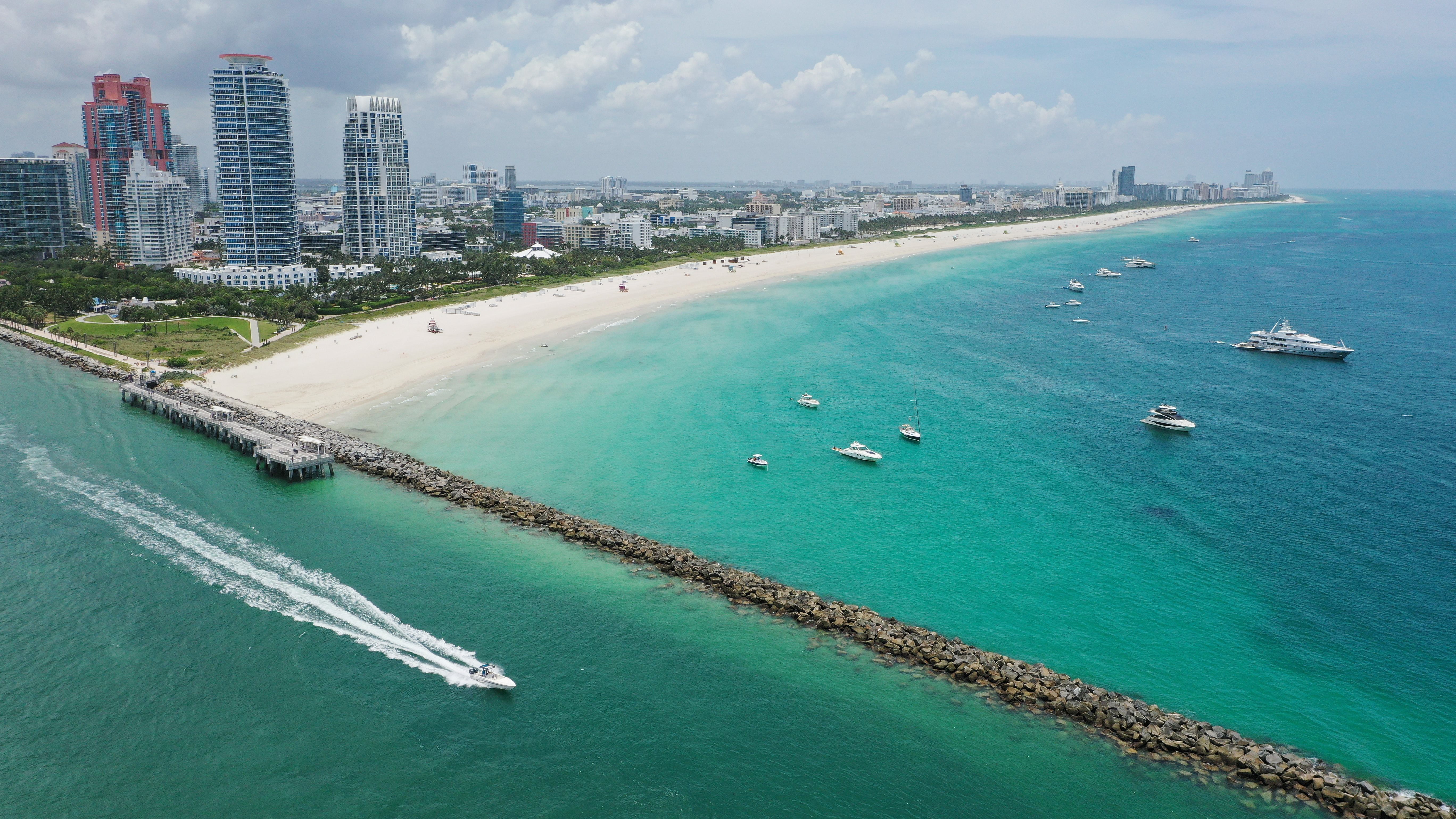 Boats are anchored off the South Beach neighborhood of Miami Beach