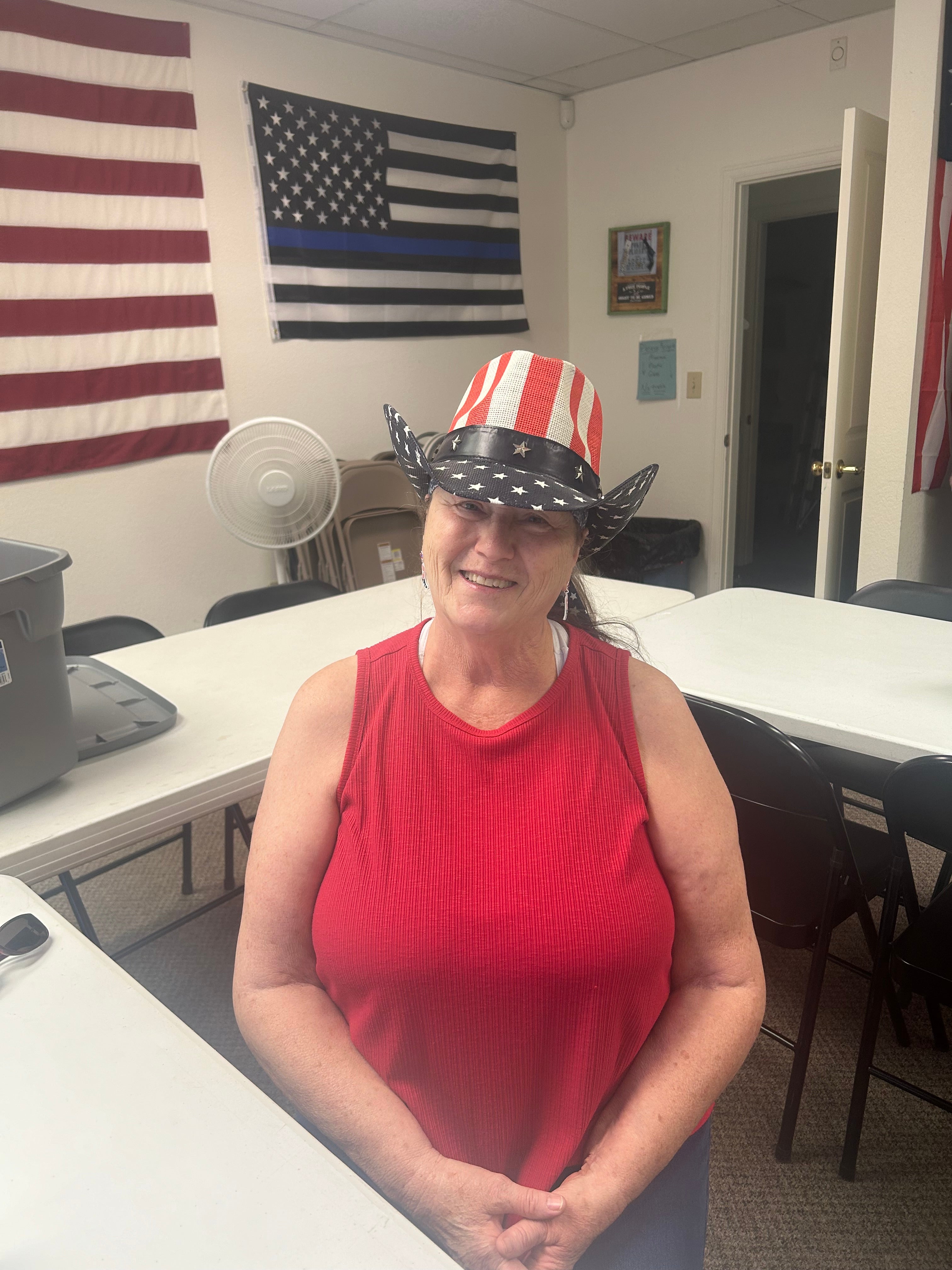 Voter Roxie Geigle sits in the Mesa Count Republicans office in Grand Junction; she was sad to see Boebert’s departure and feels Ron Hanks is the best candidate now for the district