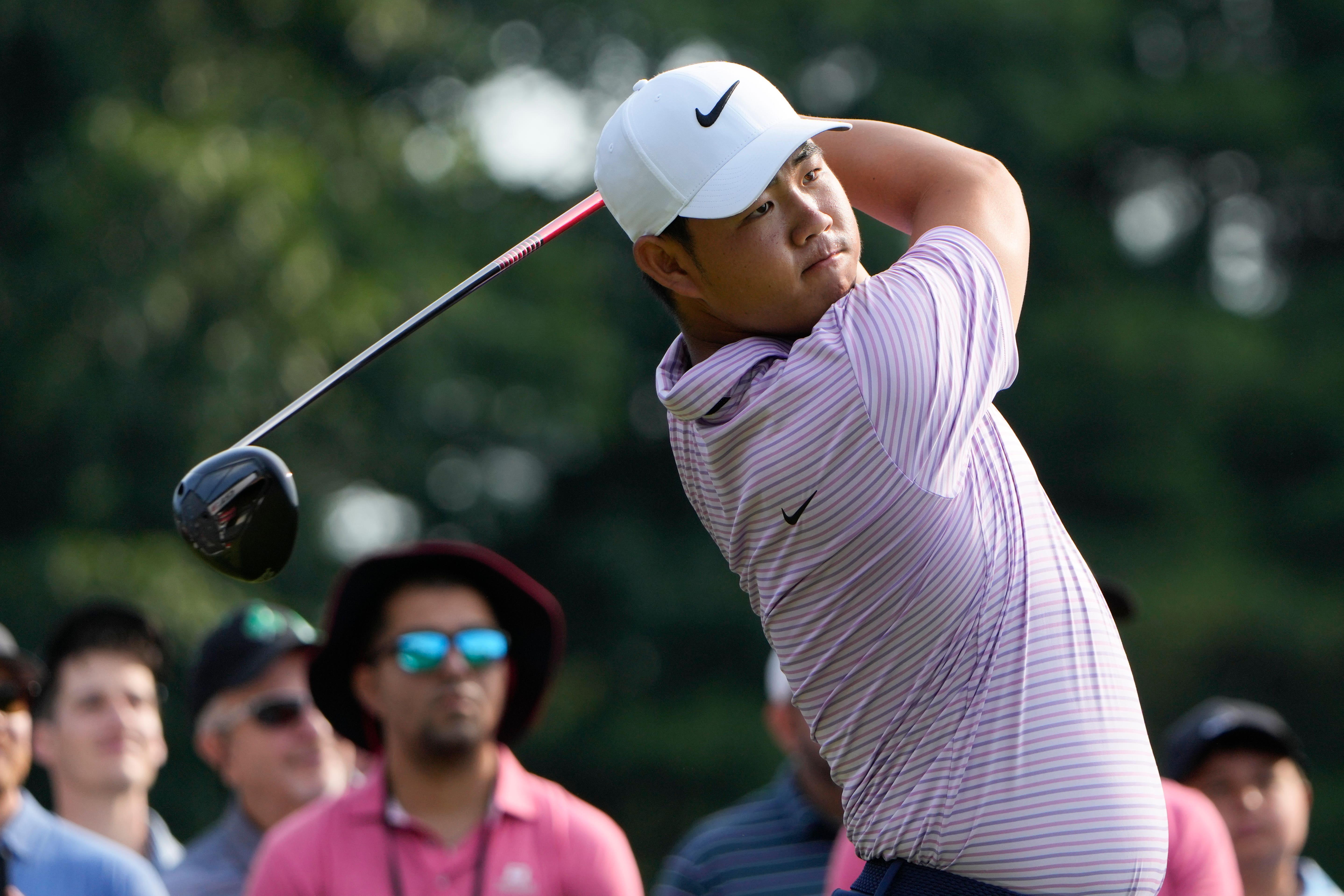 Tom Kim, of South Korea, hits from the first tee during the second round of the Travelers Championship (Seth Wenig/AP)