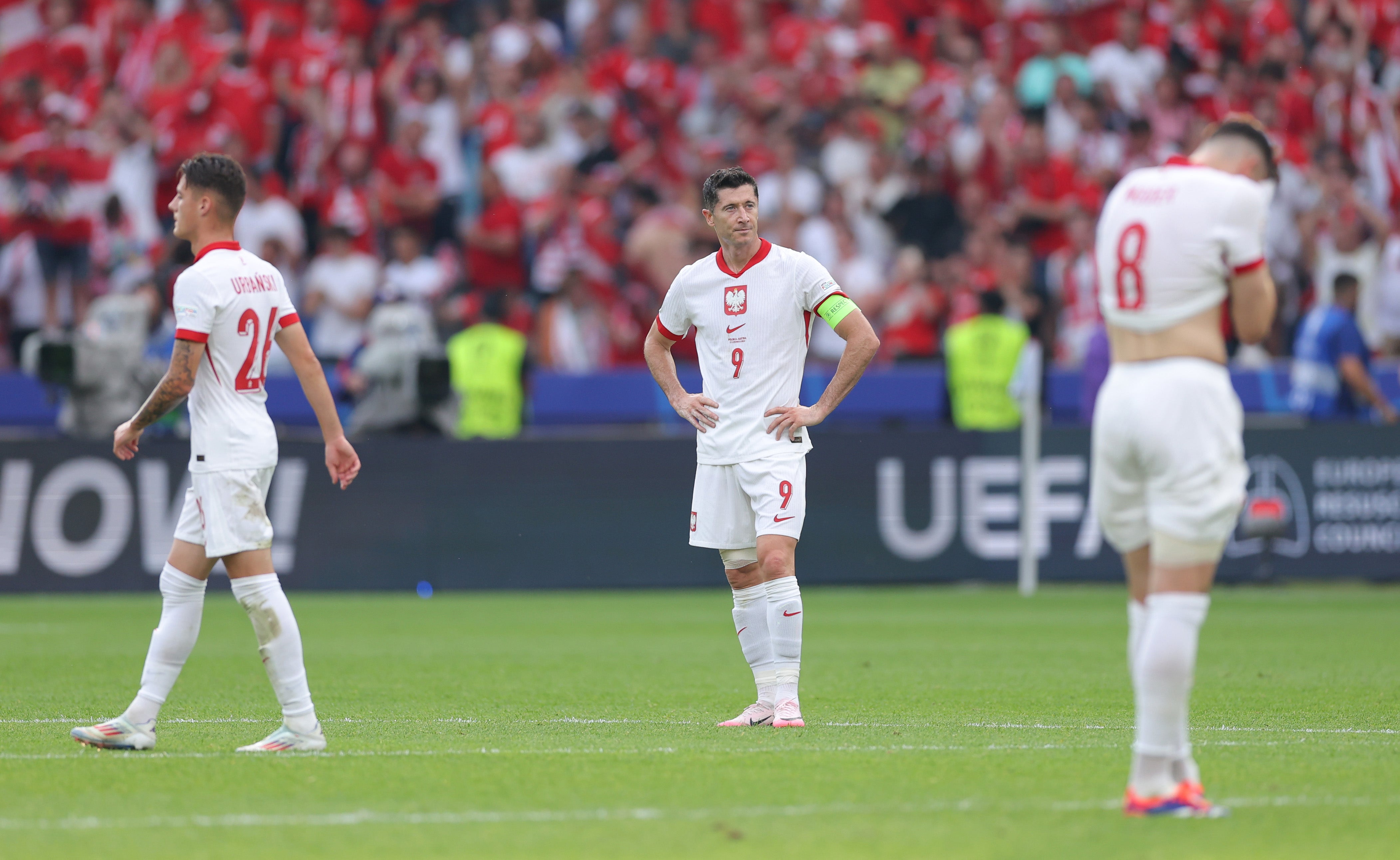 Robert Lewandowski of Poland looks dejected after the team's defeat