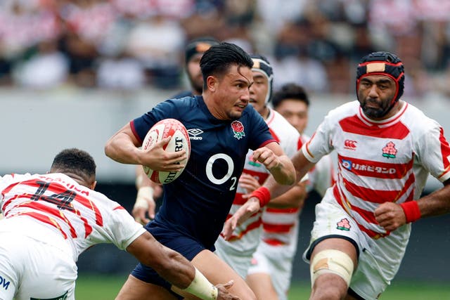 <p>England fly-half Marcus Smith on his way to score a try against Japan at the National Stadium in Tokyo</p>