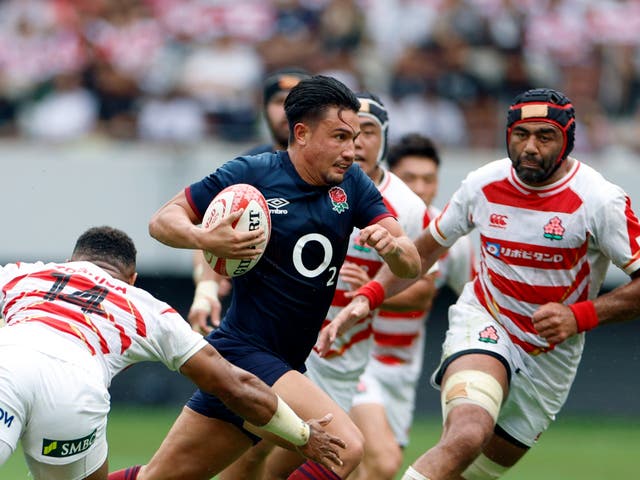 <p>England fly-half Marcus Smith on his way to score a try against Japan at the National Stadium in Tokyo</p>