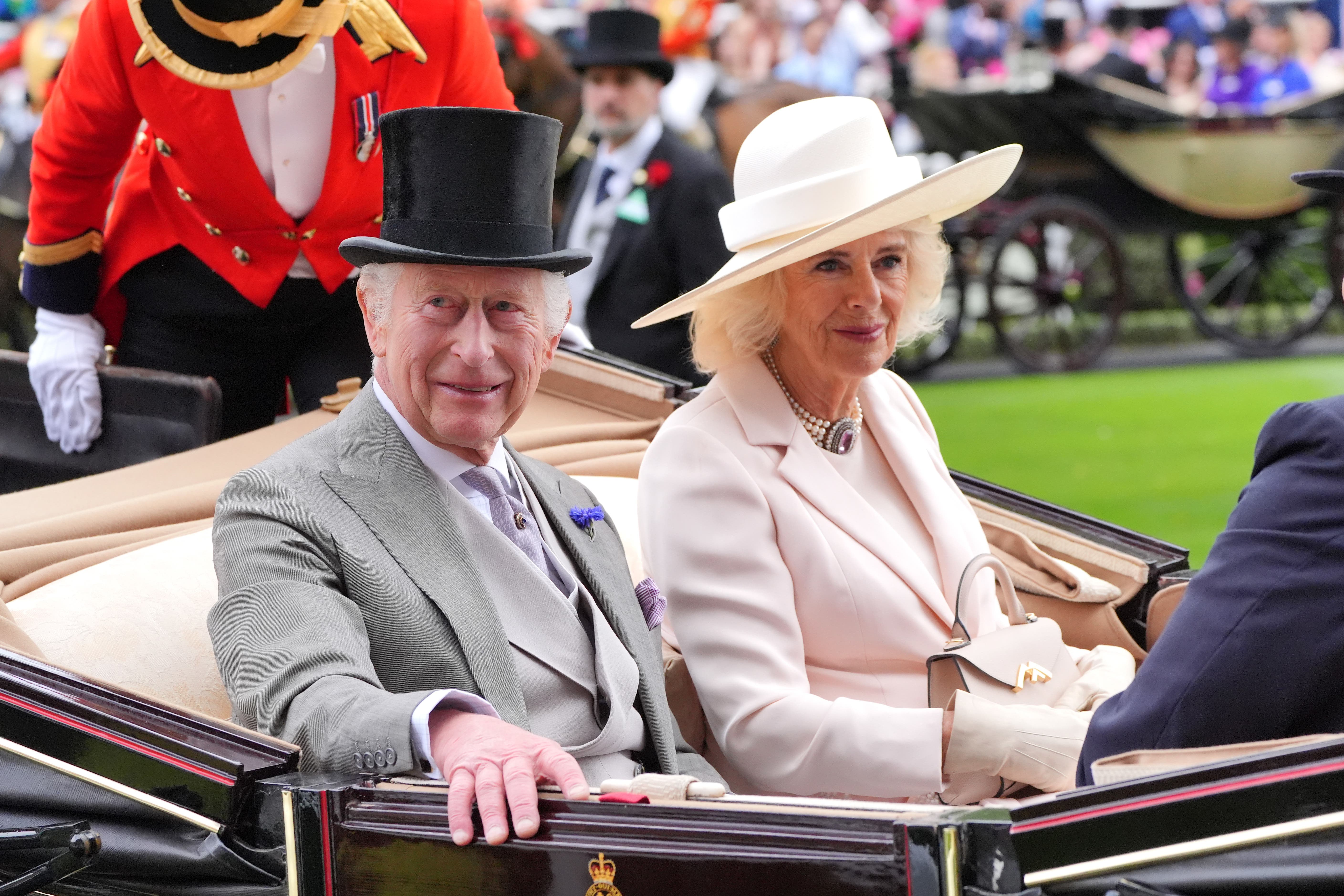 The King and Queen arrive for the fifth day of Royal Ascot (Yui Mok/PA)