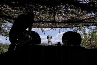 In this photo provided by Ukraine's 24th Mechanised Brigade press service, a soldier prepares to fire a 