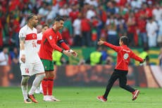 Pitch invaders, lookalikes and a steward’s slide tackle: Ninety minutes in the presence of Cristiano Ronaldo