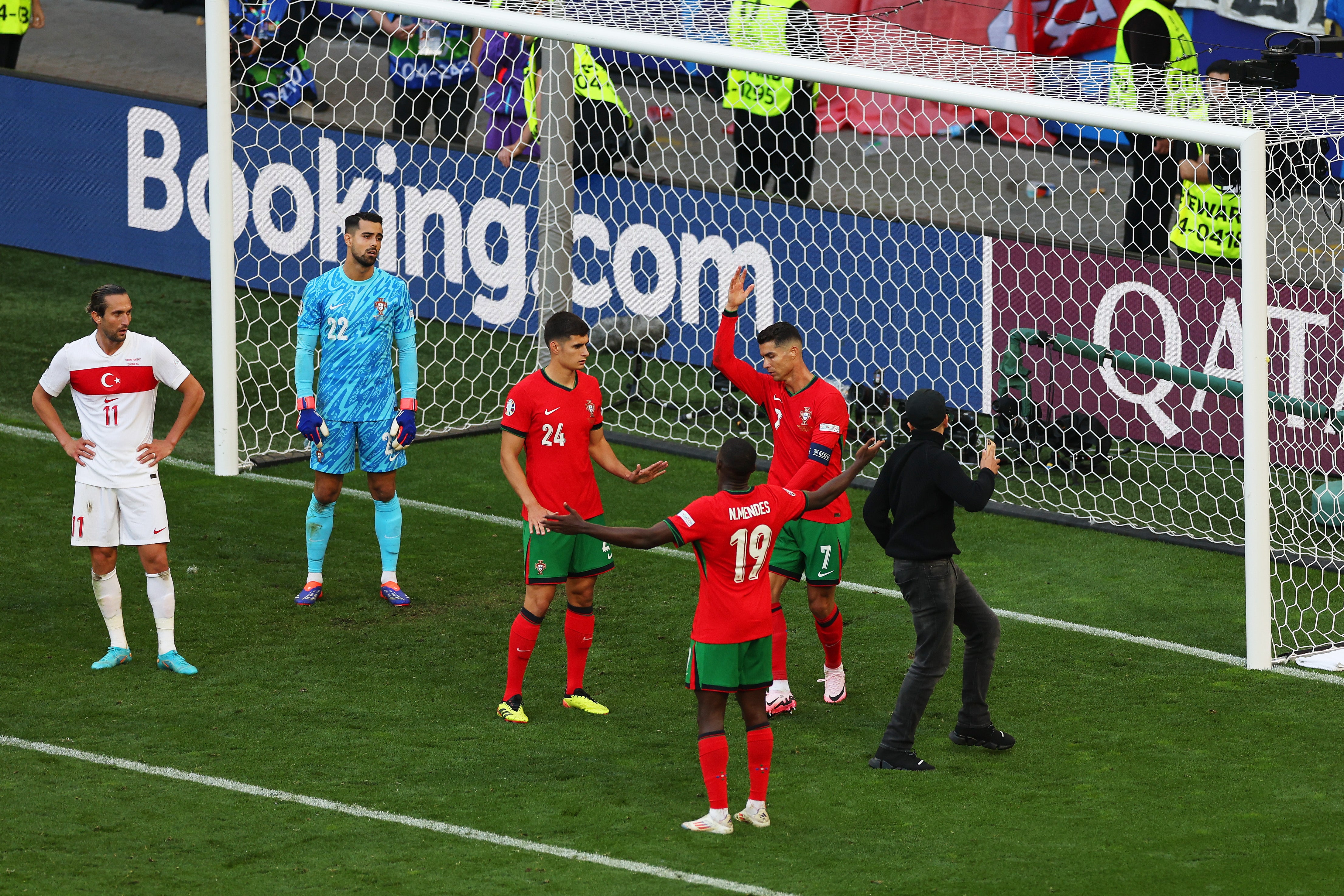 One fan reached Ronaldo at a corner as chaotic scenes marred the end of the game