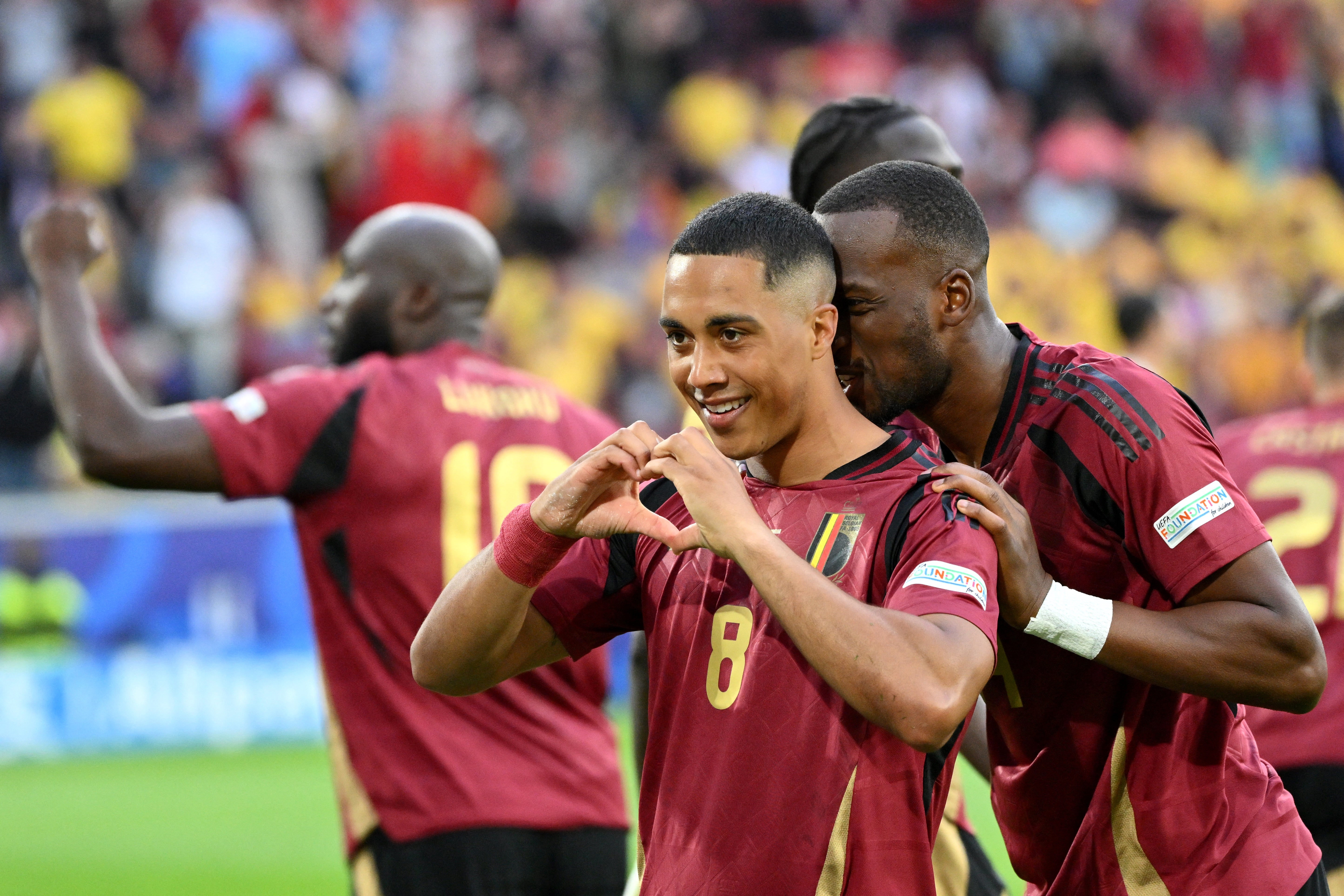 Youri Tielemans celebrates scoring Belgium's opening goal against Romania