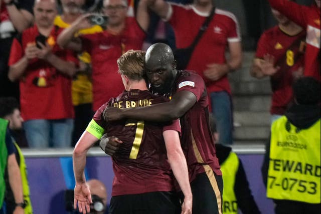 <p>Romelu Lukaku embraces Kevin De Bruyne during Belgium’s win over Romania</p>