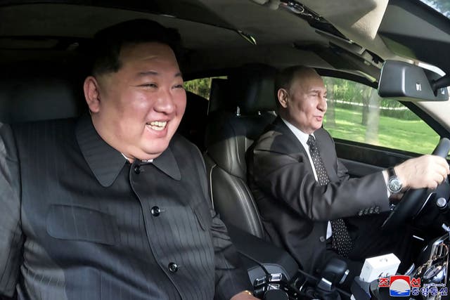 <p>In this photo provided by the North Korean government, Russia's President Vladimir Putin, right, drives a car with North Korean leader Kim Jong Un sitting in front passenger seat at a garden of the Kumsusan State Guest House in Pyongyang, North Korea Wednesday, June 19, 2024</p>