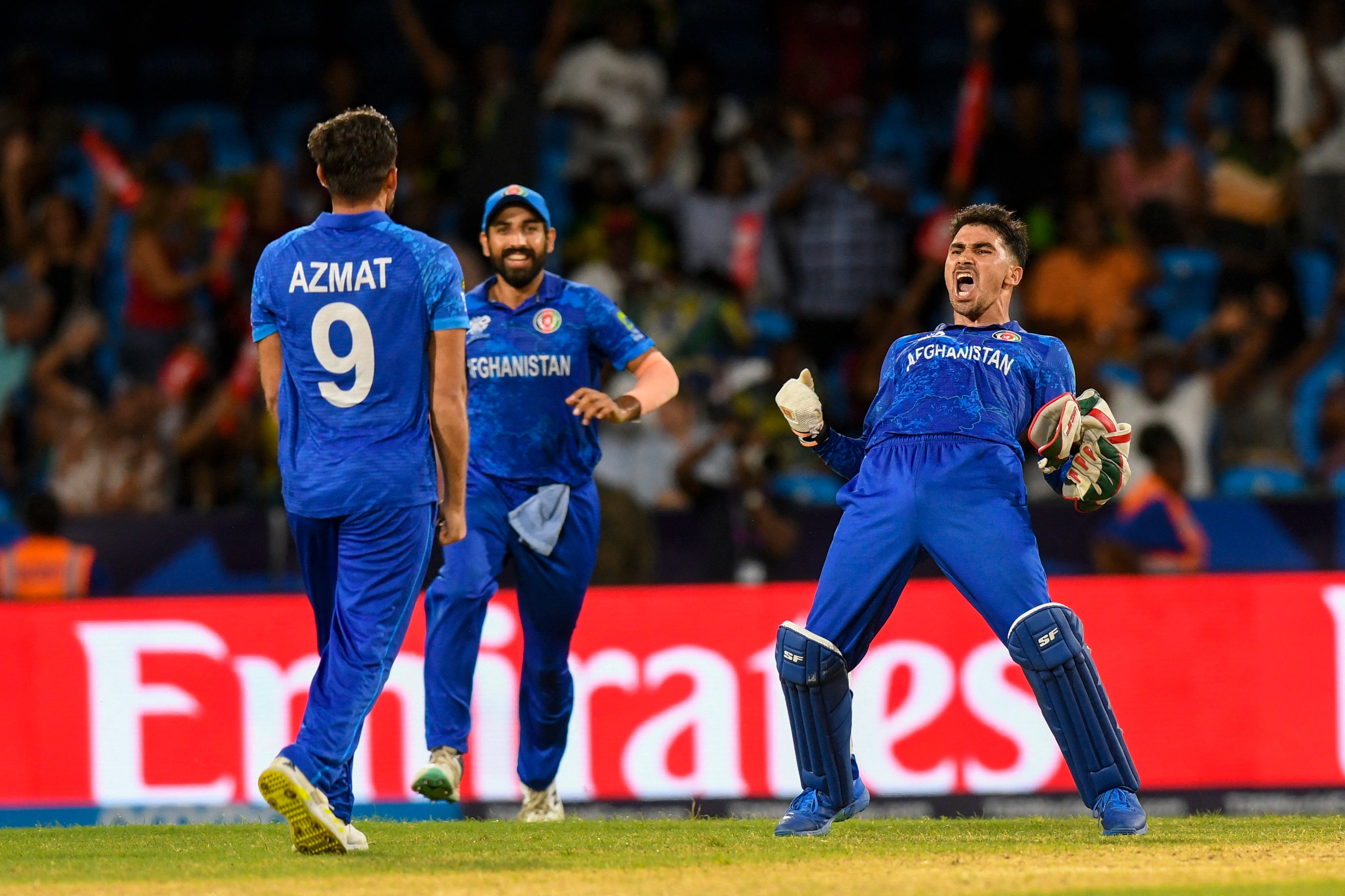Afghanistan’s players celebrate after beating Australia