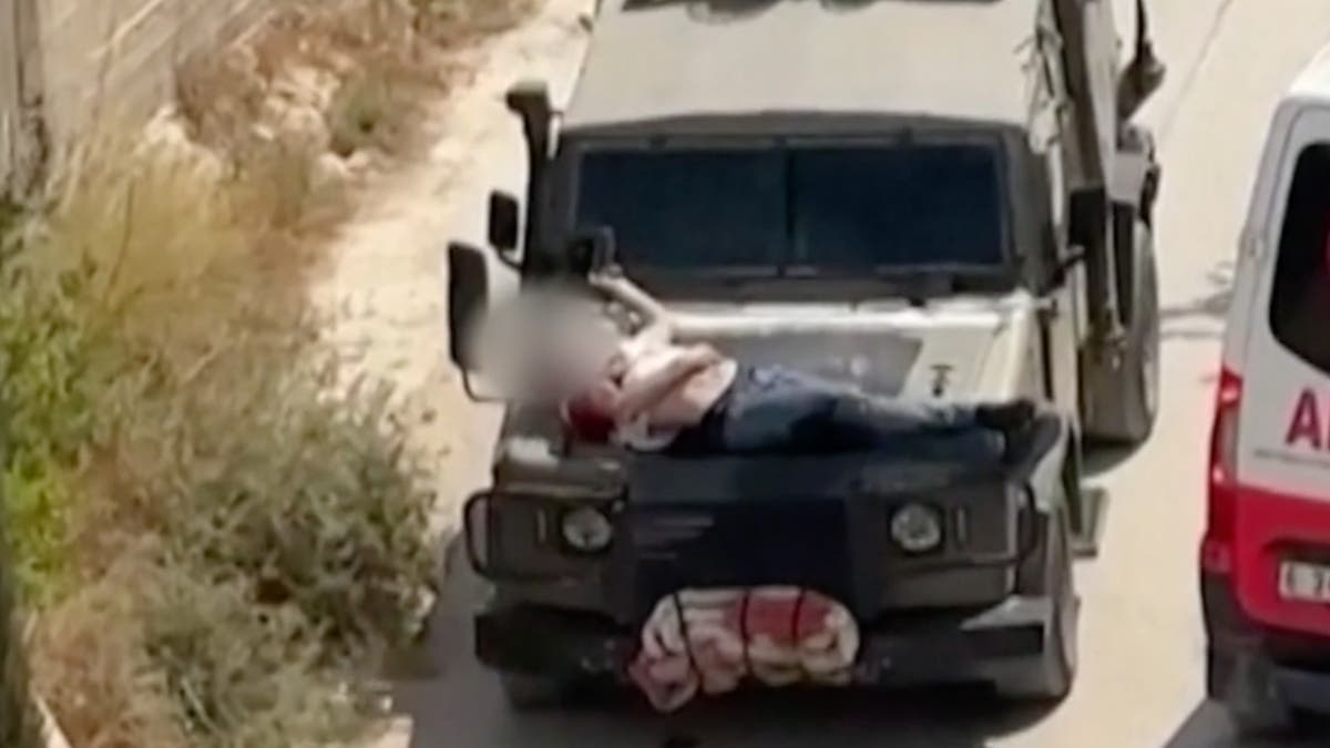 Israeli troops strap Palestinian to jeep in West Bank as strikes kill 39 in Gaza