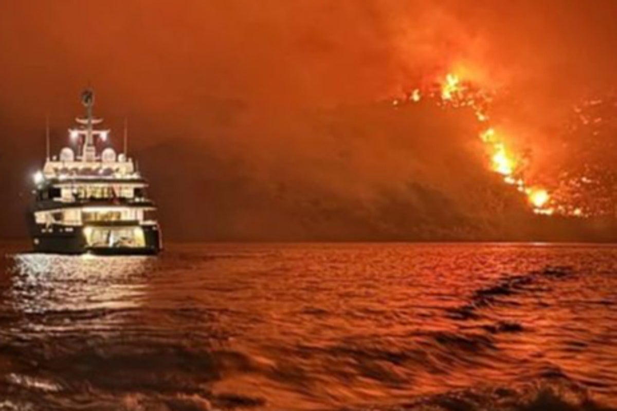 Fireworks launched from yacht ‘spark forest fire in Greece’ leading to 13 arrests