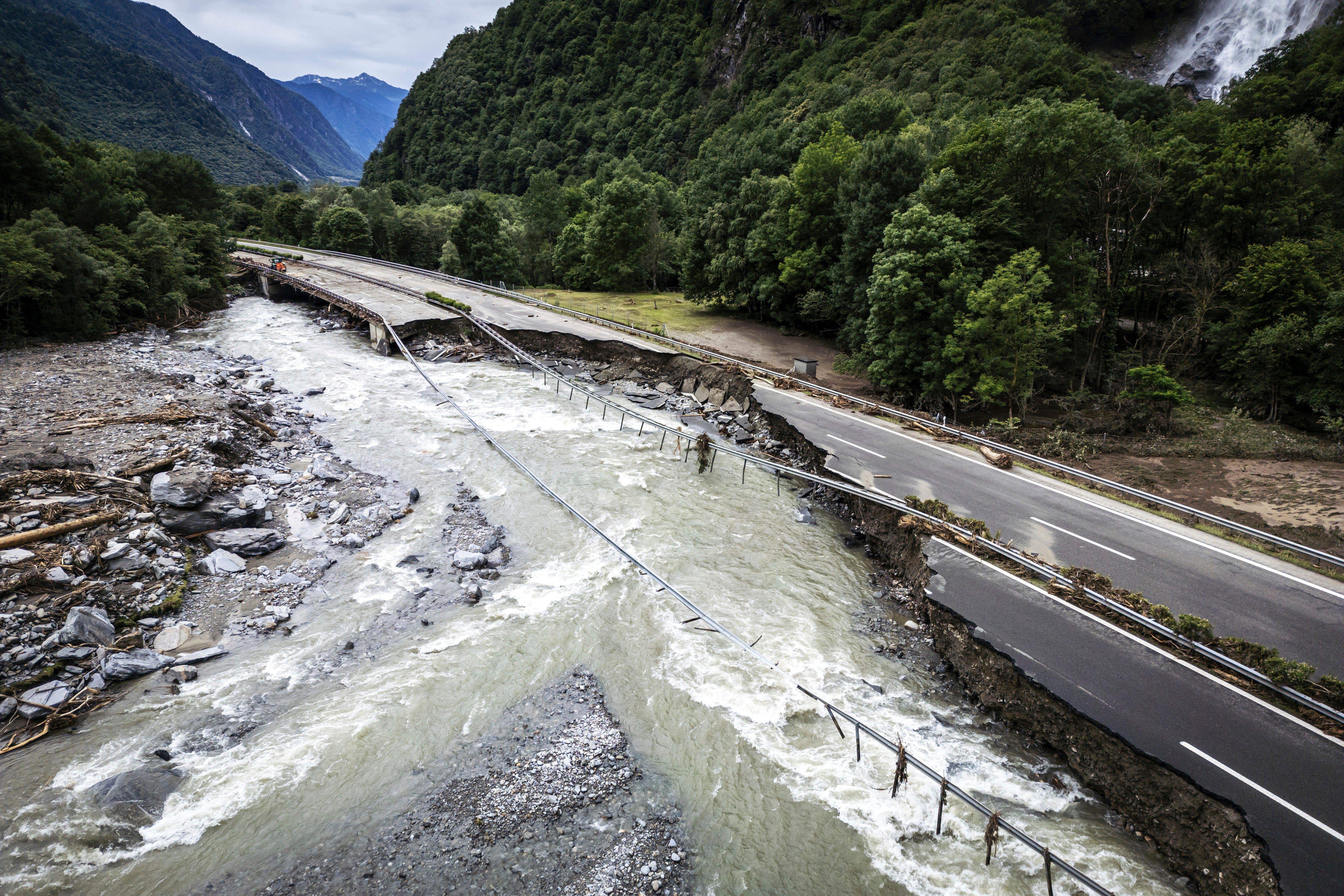 The highway A13 between Lostallo and Soazza is seen destroyed by the force of the Moesa river, caused by heavy rain