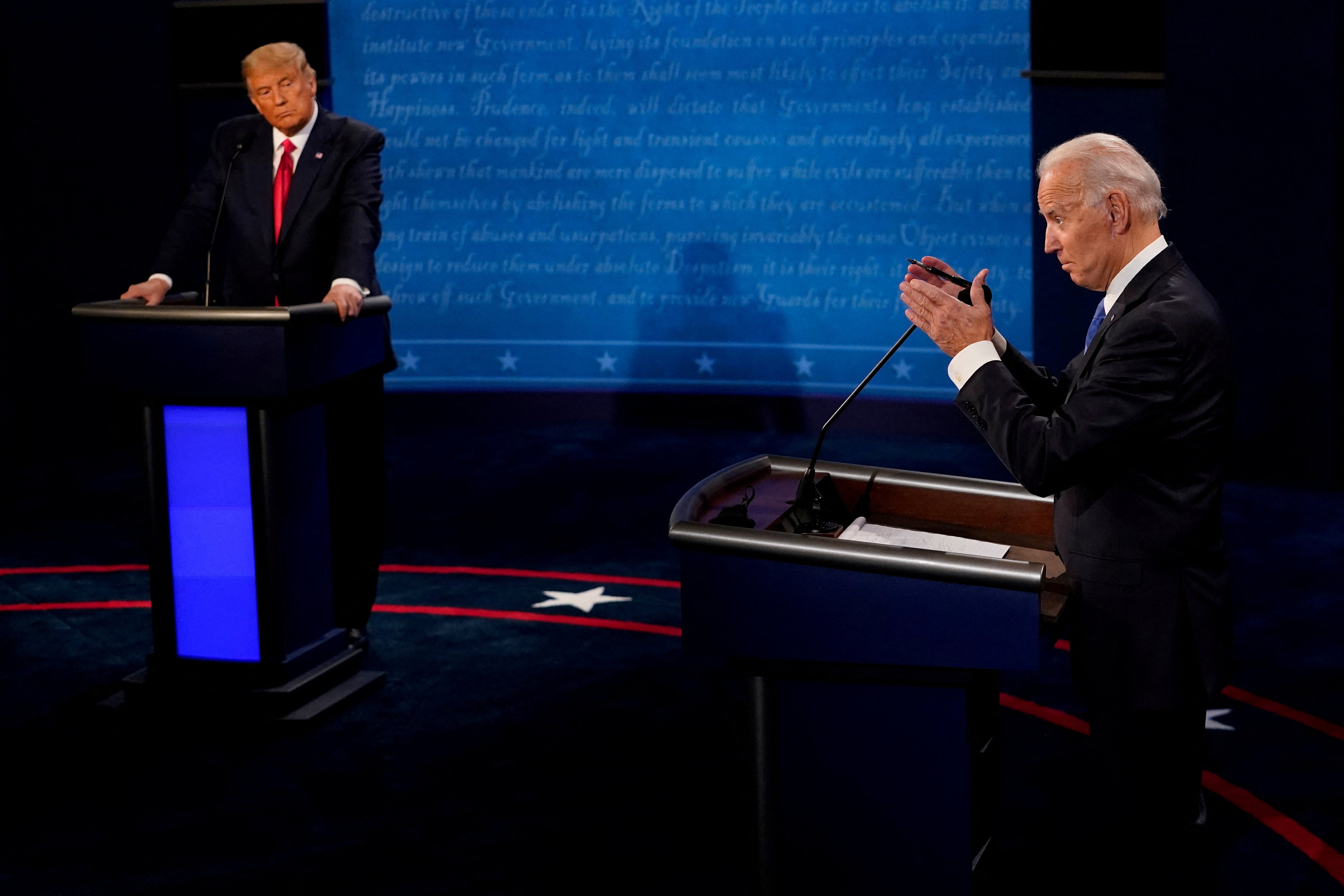 Democratic presidential candidate former Vice President Joe Biden answers a question as President Donald Trump listens during the second and final presidential debate in the 2020 election