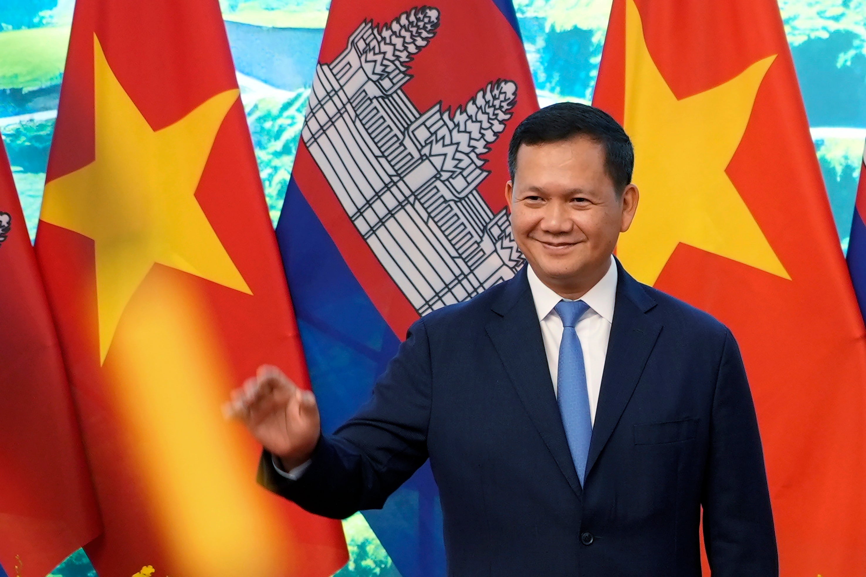 Cambodian Prime Minister Hun Manet poses for photo, in Hanoi, Vietnam on Dec.11, 2023. A court in Cambodia has formally charged a real estate entrepreneur holding a royally bestowed title with the premeditated murder of a young couple in the capital Phnom Penh, a case that has sparked widespread public outrage. The case attracted massive attention largely because the suspect held the title of Oknha, an honorific bestowed on business people who donate large sums of money to the government. (AP Photo/Hau Dinh, File)