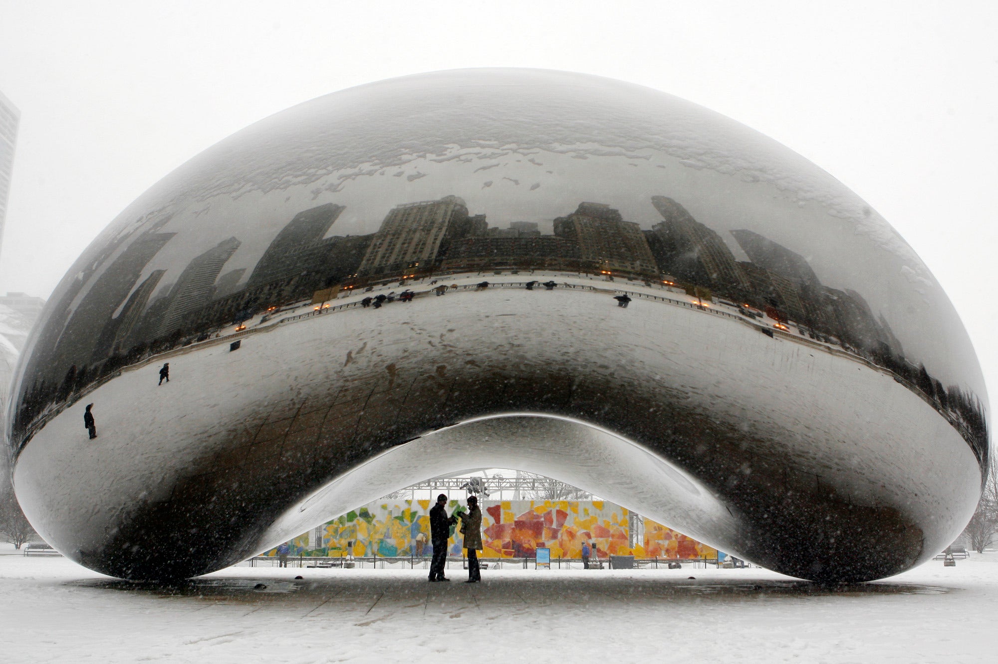 In this Jan. 31, 2008, file photo, a couple is seen on the underside of the 110-ton stainless steel sculpture