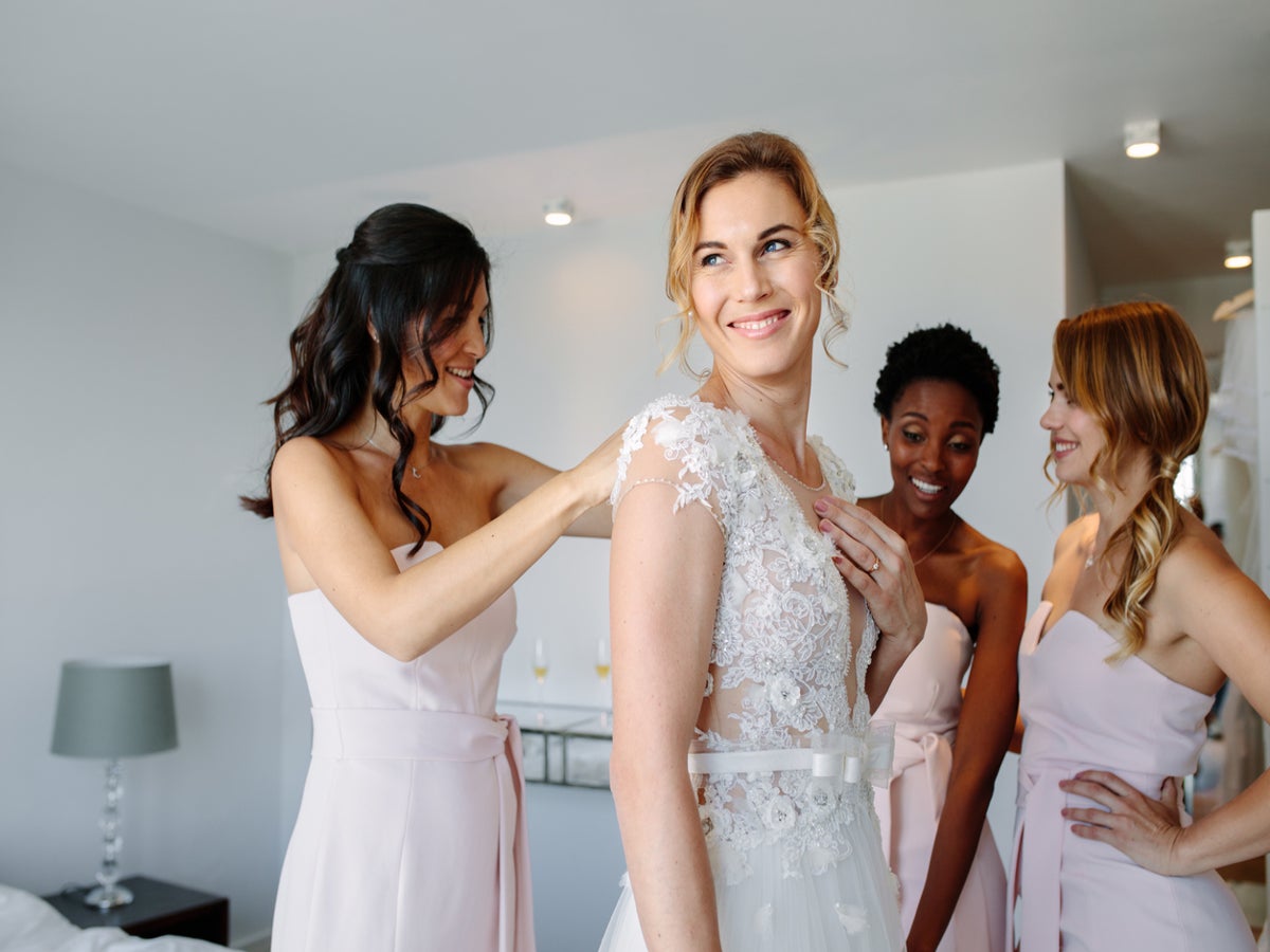 Bride defended for replacing maid-of-honor who refused to buy her dress for  wedding | The Independent