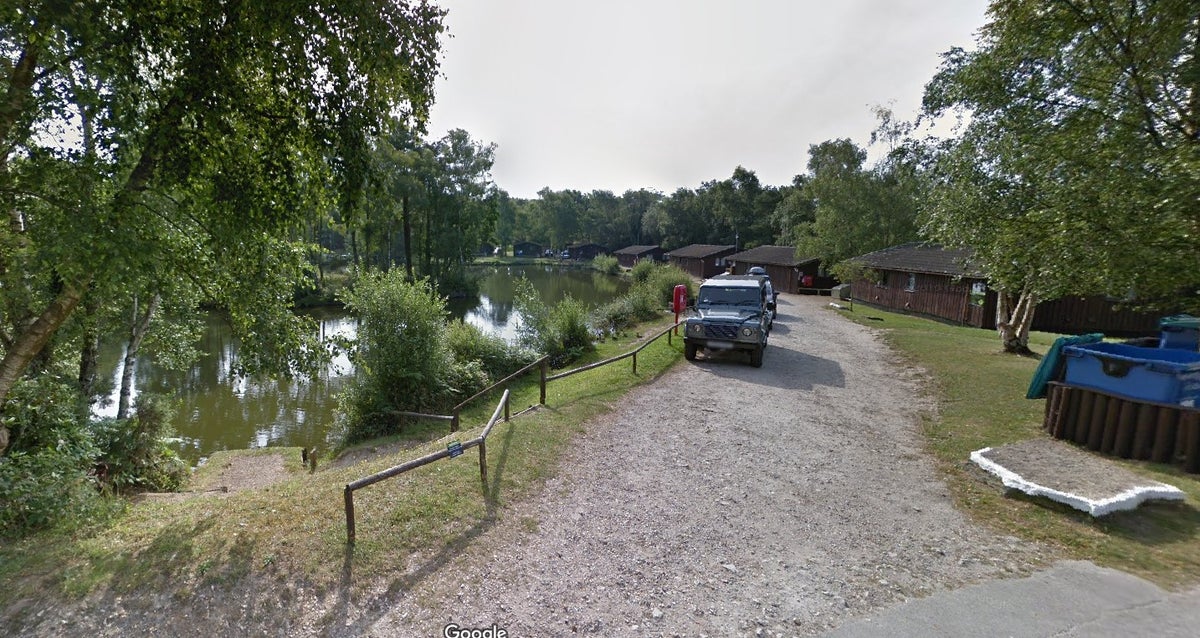 Pair arrested on suspicion of murder after man found dead in lake at holiday park in Dorset