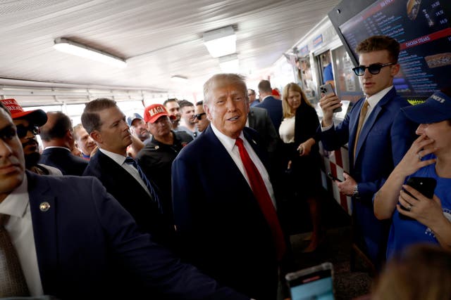 <p>Republican presidential candidate, former president Donald Trump poses for photos with supporters at sandwich stop Tony and Nick's steaks in Philadelphia. A former Trump confidant says he made Nazi jokes in front of Jewish executives.   </p>
