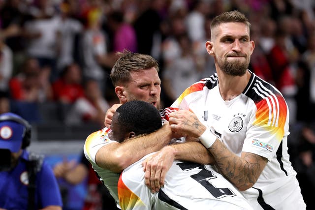 <p>Niclas Fullkrug (centre) celebrates scoring a late equaliser against Switzerland</p>