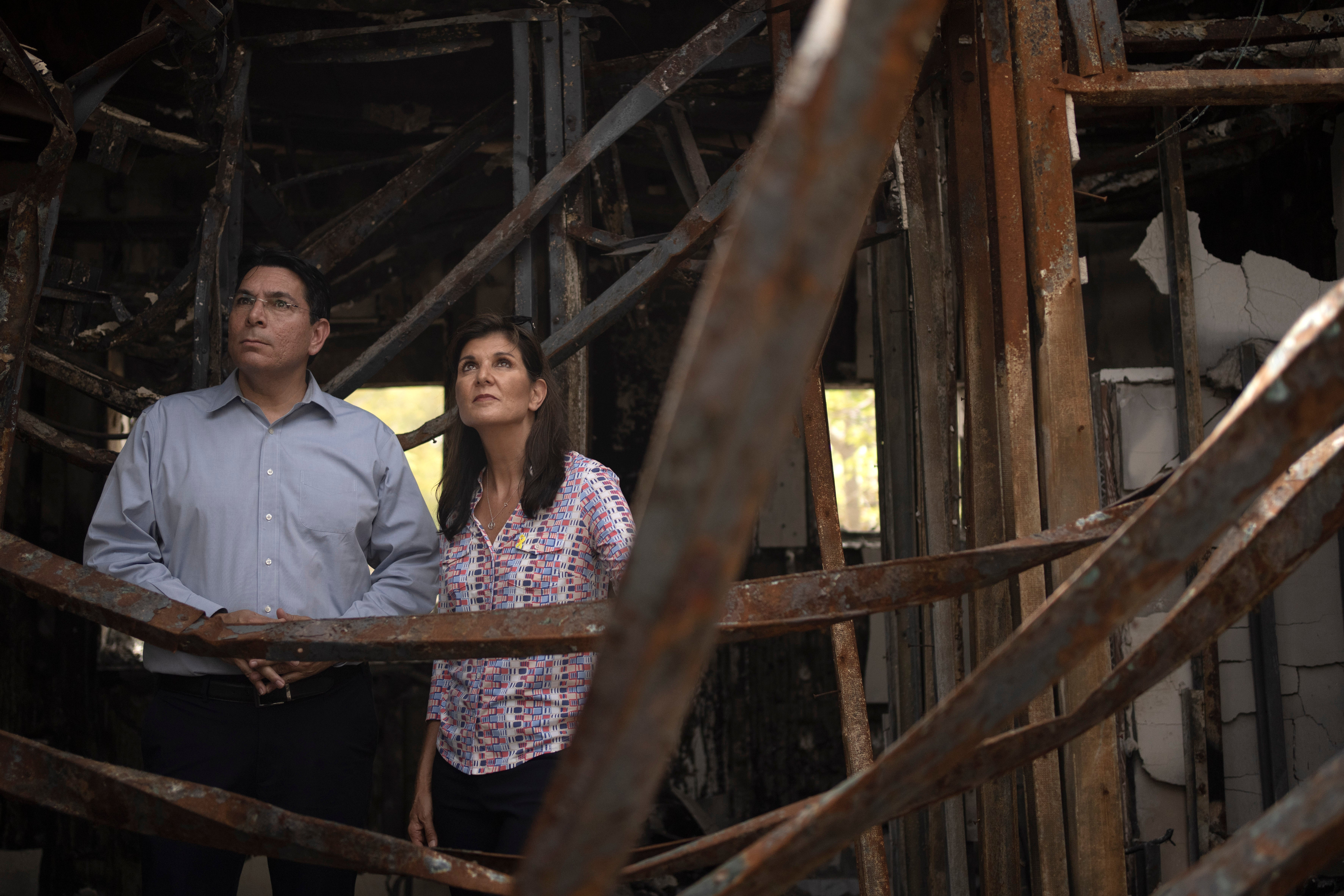 Danny Danon, a member of the Knesset, Israel's parliament, left, and Nikki Haley, former U.S. Ambassador to the United Nations, visit a home torched by Hamas in Kibbutz Nir Oz in southern Israel, Monday, May 27, 2024