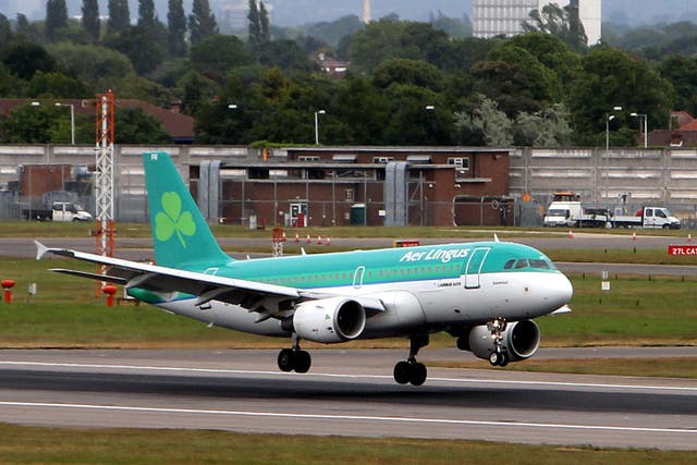 An Aer Lingus plane lands at Heathrow Airport in London (Steve Parsons/PA)