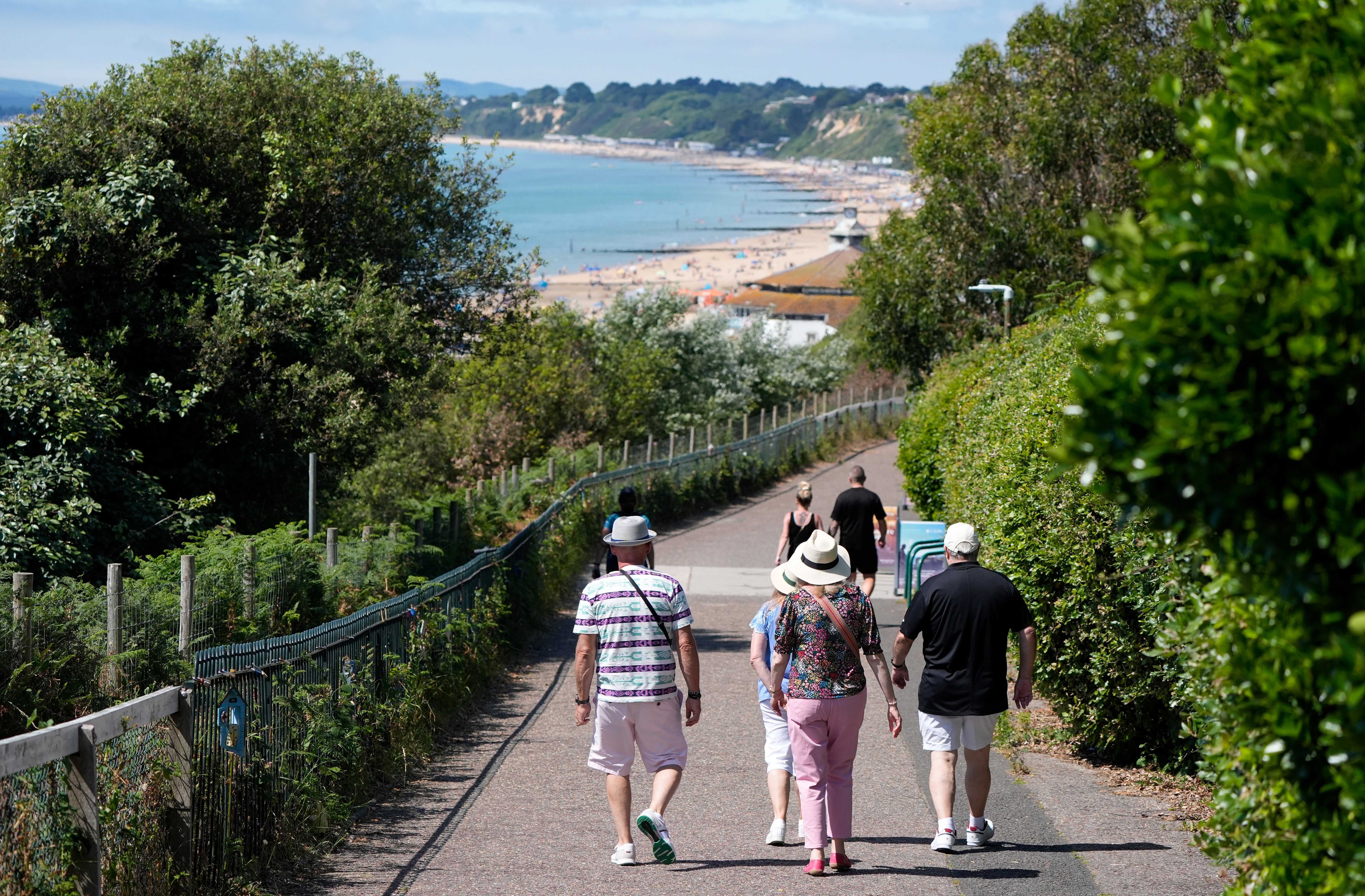 People make their way down towards Bournemouth Beach