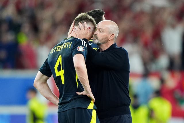 <p>Steve Clarke consoles Scott McTominay at full-time</p>