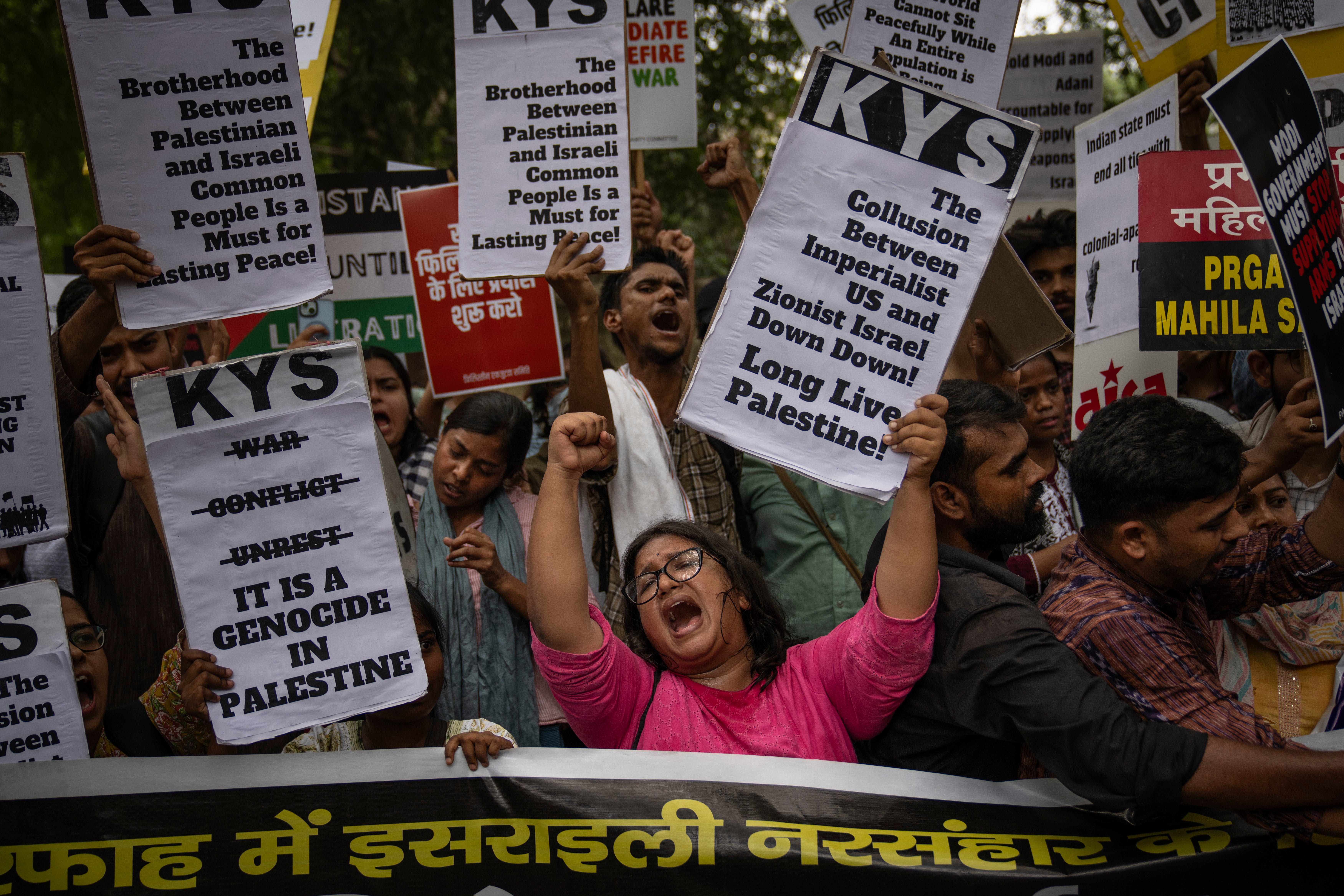 Student activists display placards and shout slogans against the war in Gaza and to show solidarity with the Palestinian people during a protest in New Delhi, India