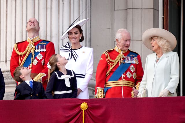 The Prince and Princess of Wales with their children, Prince George, Prince Louis and Princess Charlotte and the King and Queen on the balcony of Buckingham Palace (Gareth Fuller/PA)