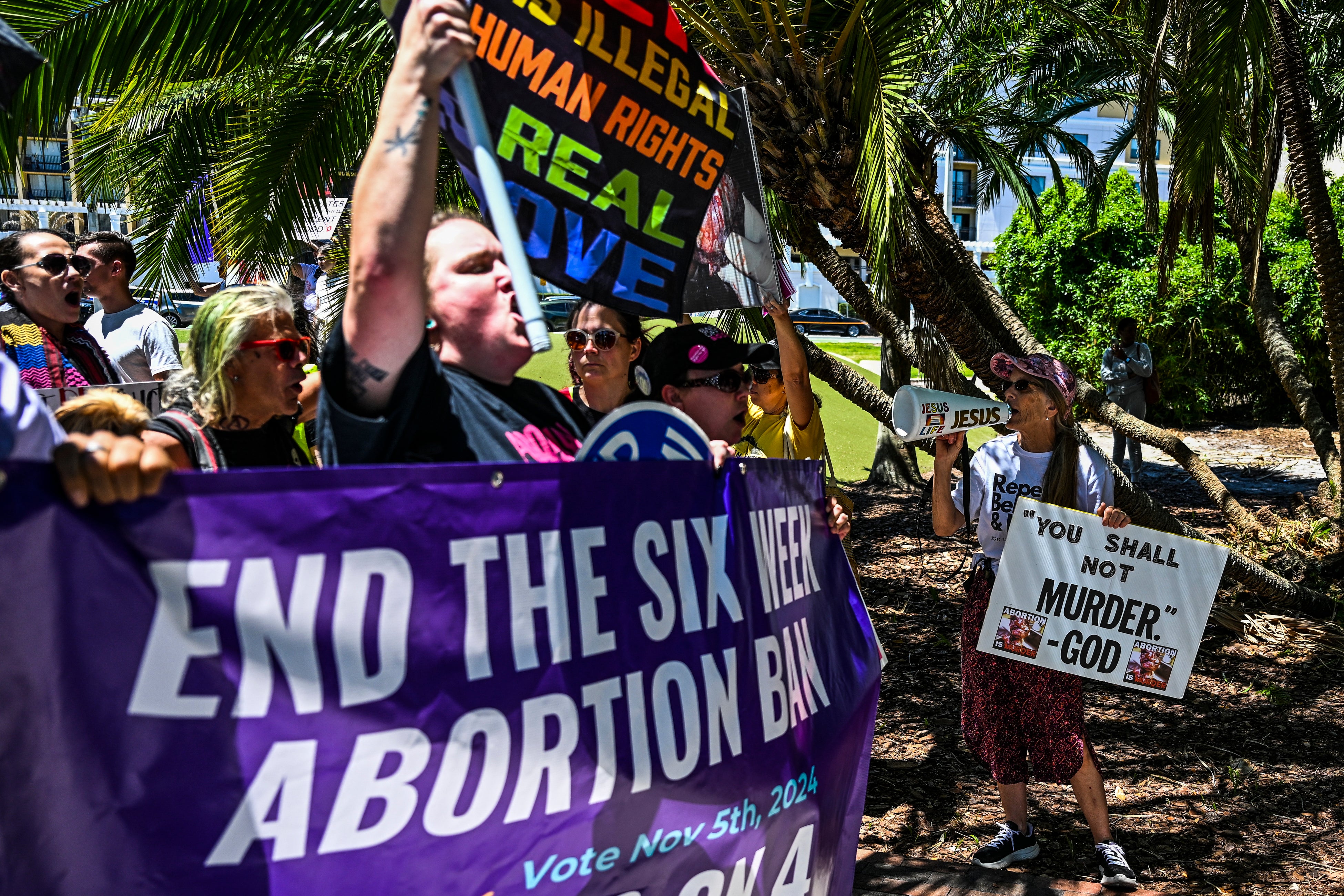 Demonstrators and counter-demonstrators gather in Orlando, Florida to protest the state’s six-week abortion ban that went into effect on May 1, 2024