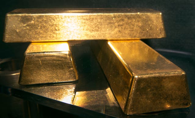 <p>Three .9999 fine gold bars, 400 troy ounces or 28 lbs each, with a combined value of more than  USD 2 million, are displayed at the Bureau of Engraving and Printing August 27, 2012, in Washington, DC</p>