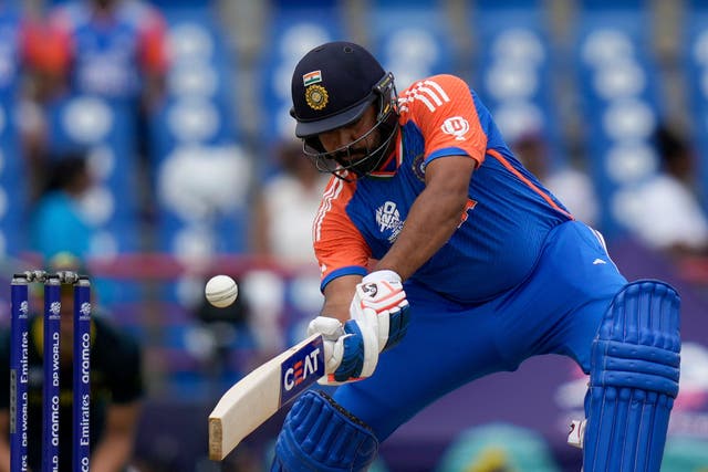 India’s captain Rohit Sharma plays a shot against Australia (Ramon Espinosa/AP)