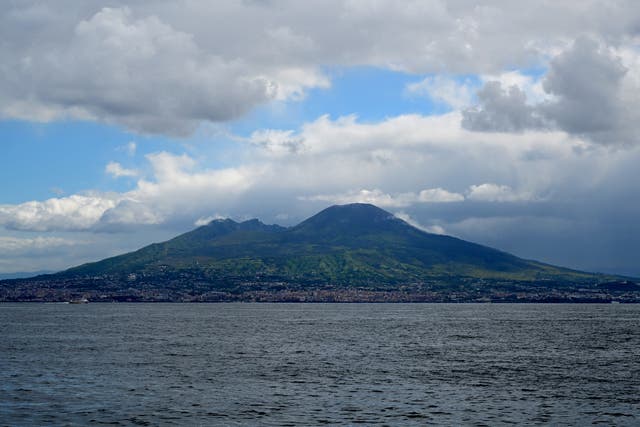 <p>This photograph taken on 20 April 2024, shows a view of the volcano Mount Vesuvius from a ferry boat, off Naples</p>