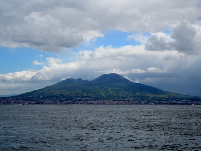 <p>This photograph taken on 20 April 2024, shows a view of the volcano Mount Vesuvius from a ferry boat, off Naples</p>