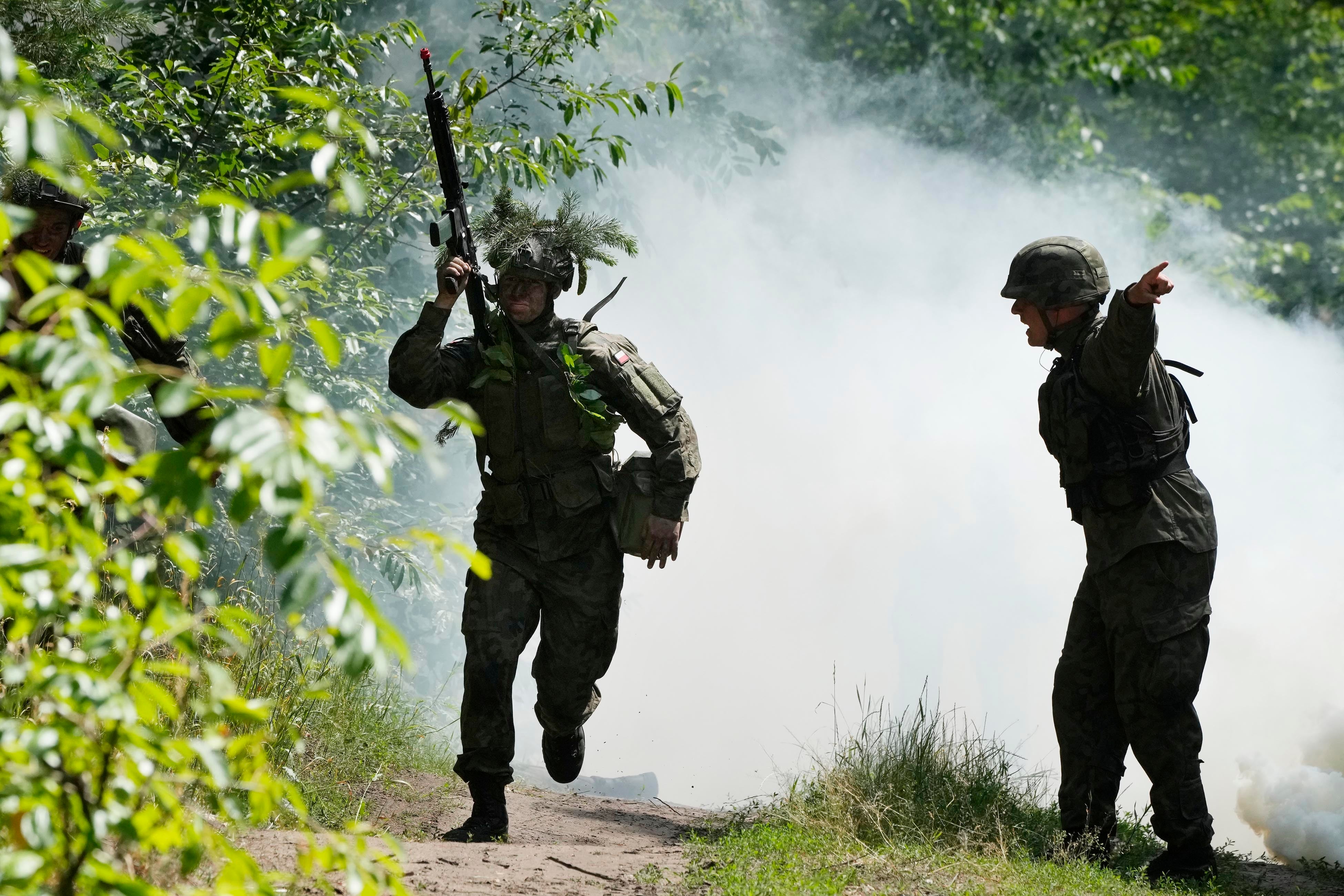 Volunteers in Poland’s army practice tactics during basic training in Nowogrod, Poland, on Thursday June 20, 2024