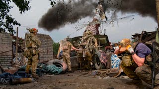 In this photo released by the Russian Defense Ministry Press Service, Russian soldiers fire the 152-mm howitzer ‘Msta-B’ in an undisclosed location in Ukraine