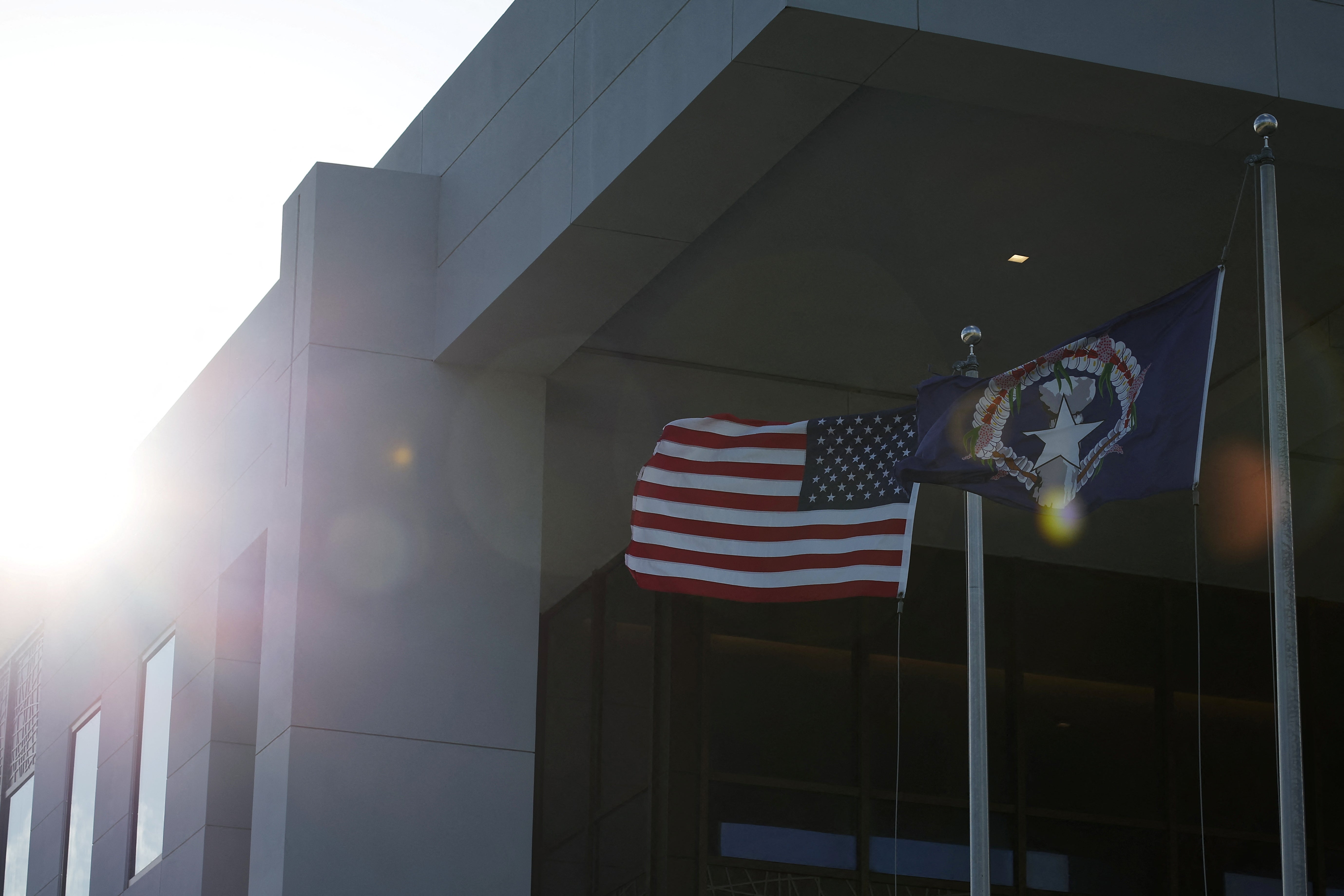 The U.S. flag flutters at a United States District Court in Saipan, Northern Mariana Island, United States, June 25, 2024. REUTERS/Kim Hong-Ji