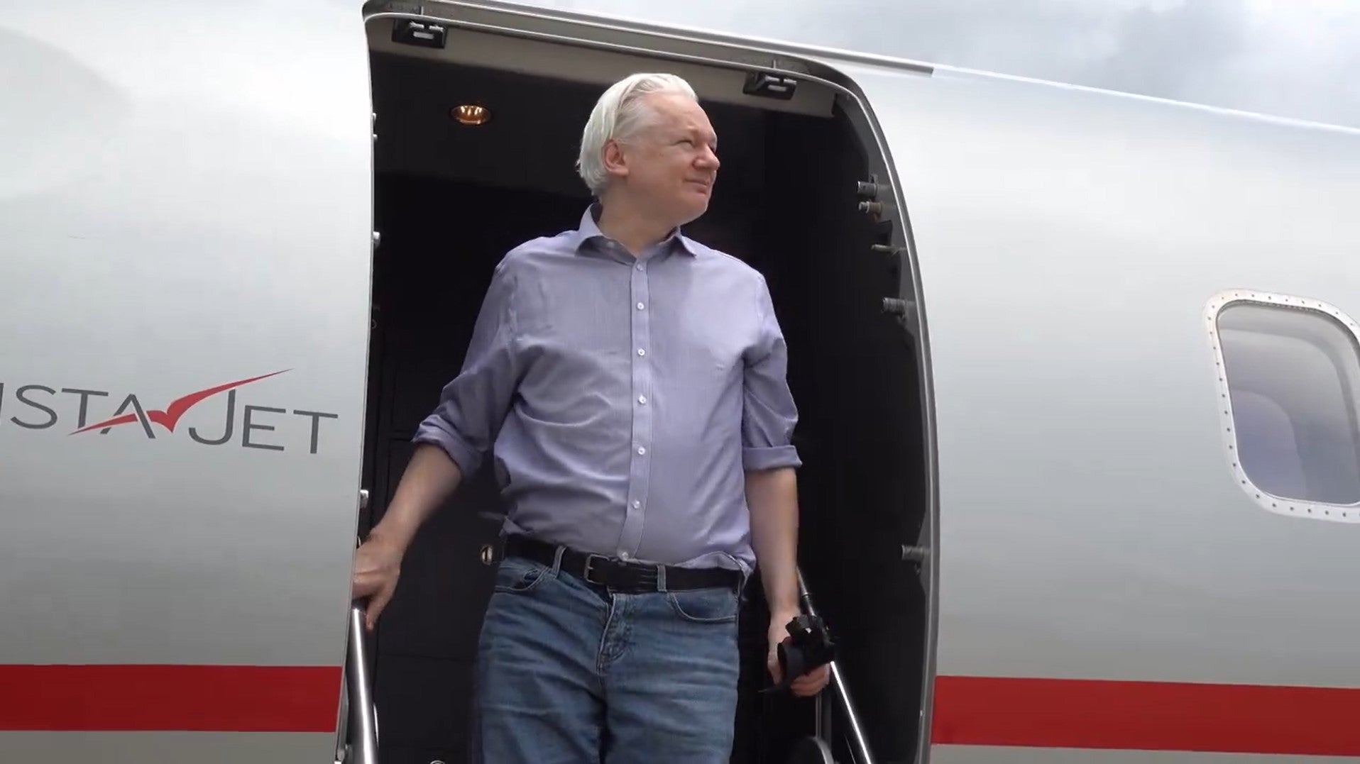 WikiLeaks founder Julian Assange arrives in Bangkok, en route to Australia after five years in a British jail