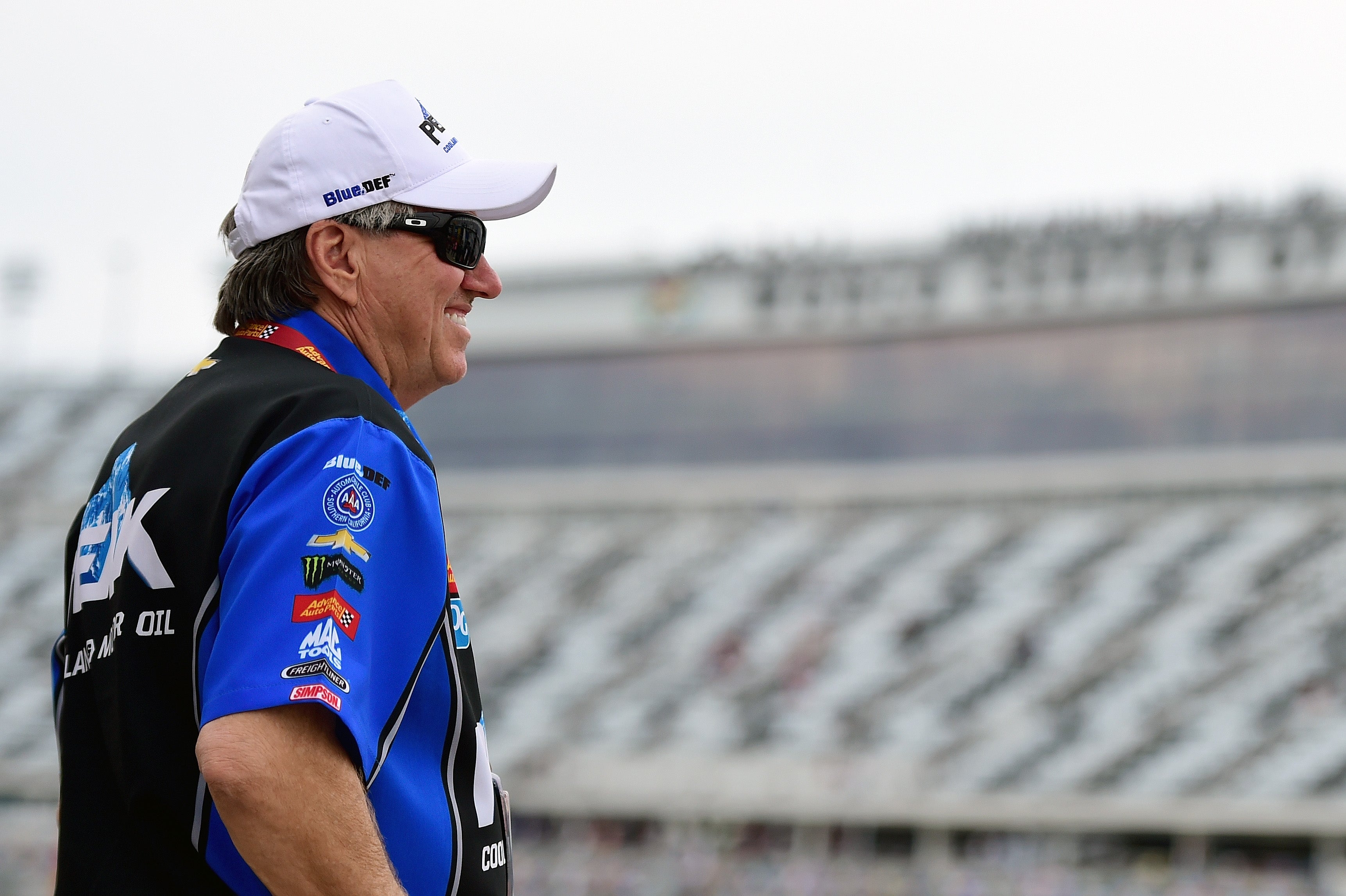 John Force, pictured, crashed into a concrete wall at 302 miles per hour while competing in the NHRA Virginia Nationals on Sunday. He is now in the intensive care unit as doctors assess his injuries.