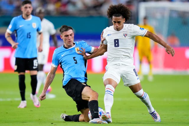 <p>Manuel Ugarte, left, in action for Uruguay in the Copa America on Sunday</p>