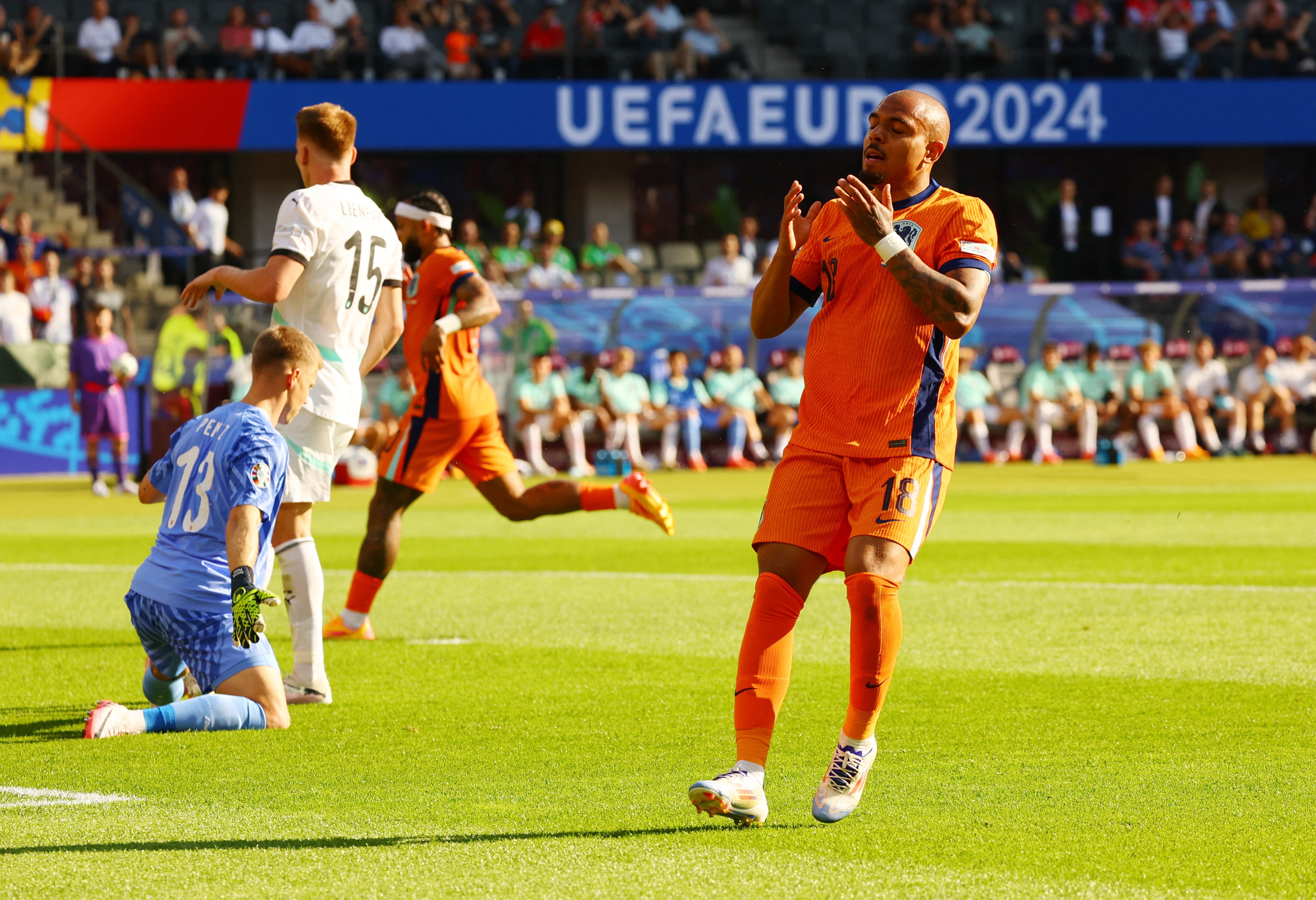 Netherlands' Donyell Malen reacts after missing a chance