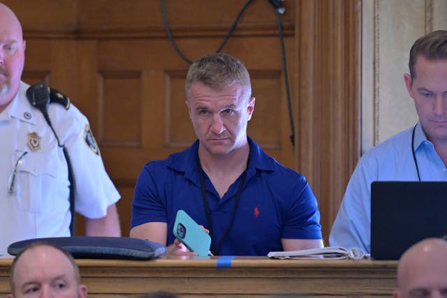 <p>Blogger Aidan Kearney, second from right, listens from the press bench during Karen Read’s murder trial in June. He has covered the case extensively but is also accused of intimidating witnesses. </p>