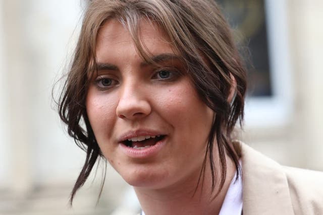 Natasha O’Brien speaking to the media as she joins protesters outside Leinster House in Dublin (Gareth Chaney/PA)